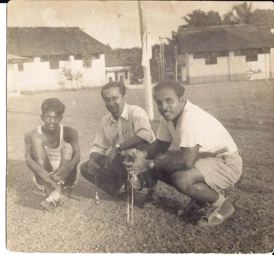 The youth in the photograph is Sri Lankan athlete Nagalingam Ethirveerasingam who posted this photograph. His coach Mr P E Rajendra, Malika's grandfather is in the center. The photo was taken in 1952.